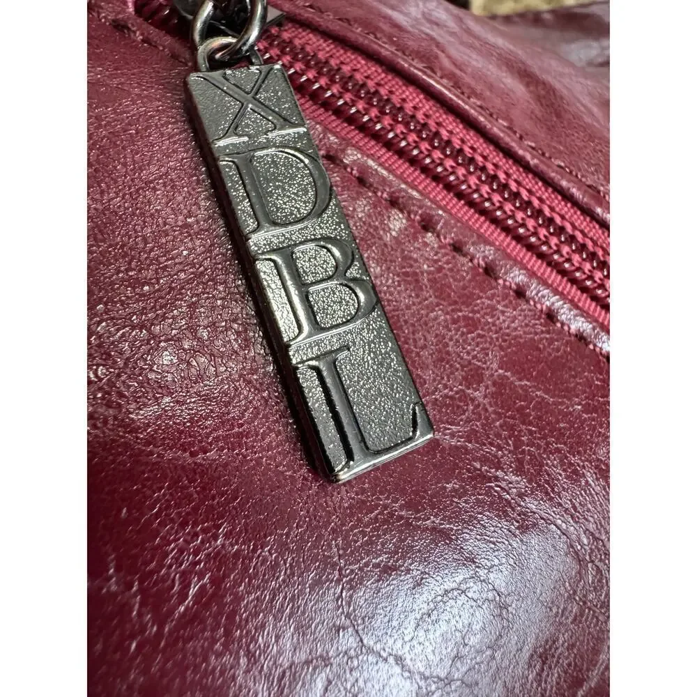 Xidibaola (XDBL) wine colored HOBO should bag an international company pebble
